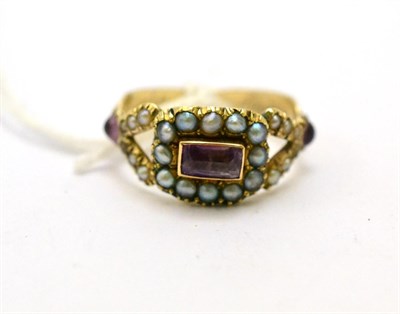 Lot 237 - # An amethyst and seed pearl mourning ring, circa 1820, a central cluster to forked stone set...