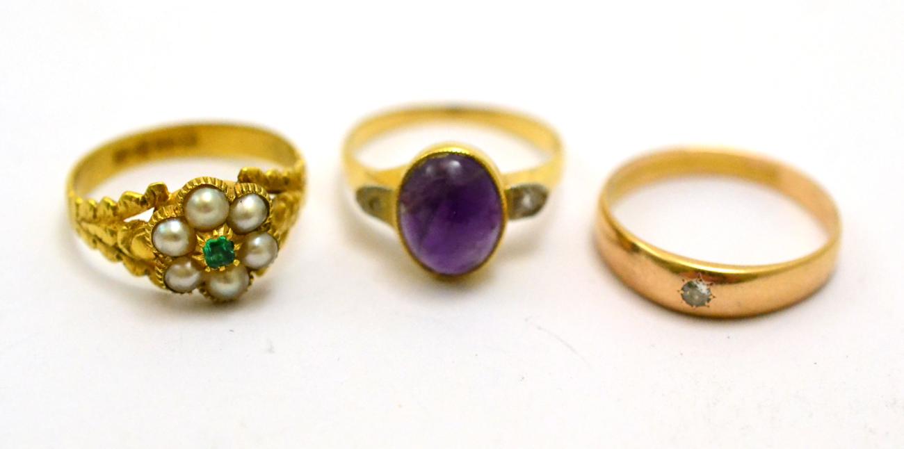 Lot 256 - # An amethyst and diamond three stone ring, finger size L1/2, a diamond solitaire ring, finger size