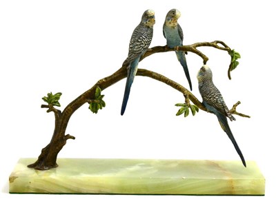 Lot 313 - A cold painted bronze figure group of budgies on a tree, raised on a green onyx base, base 33cm...