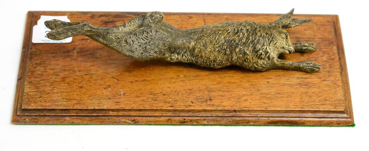 Lot 314 - A desk letter clip in the form of a cold painted bronze hare, base 31cm wide