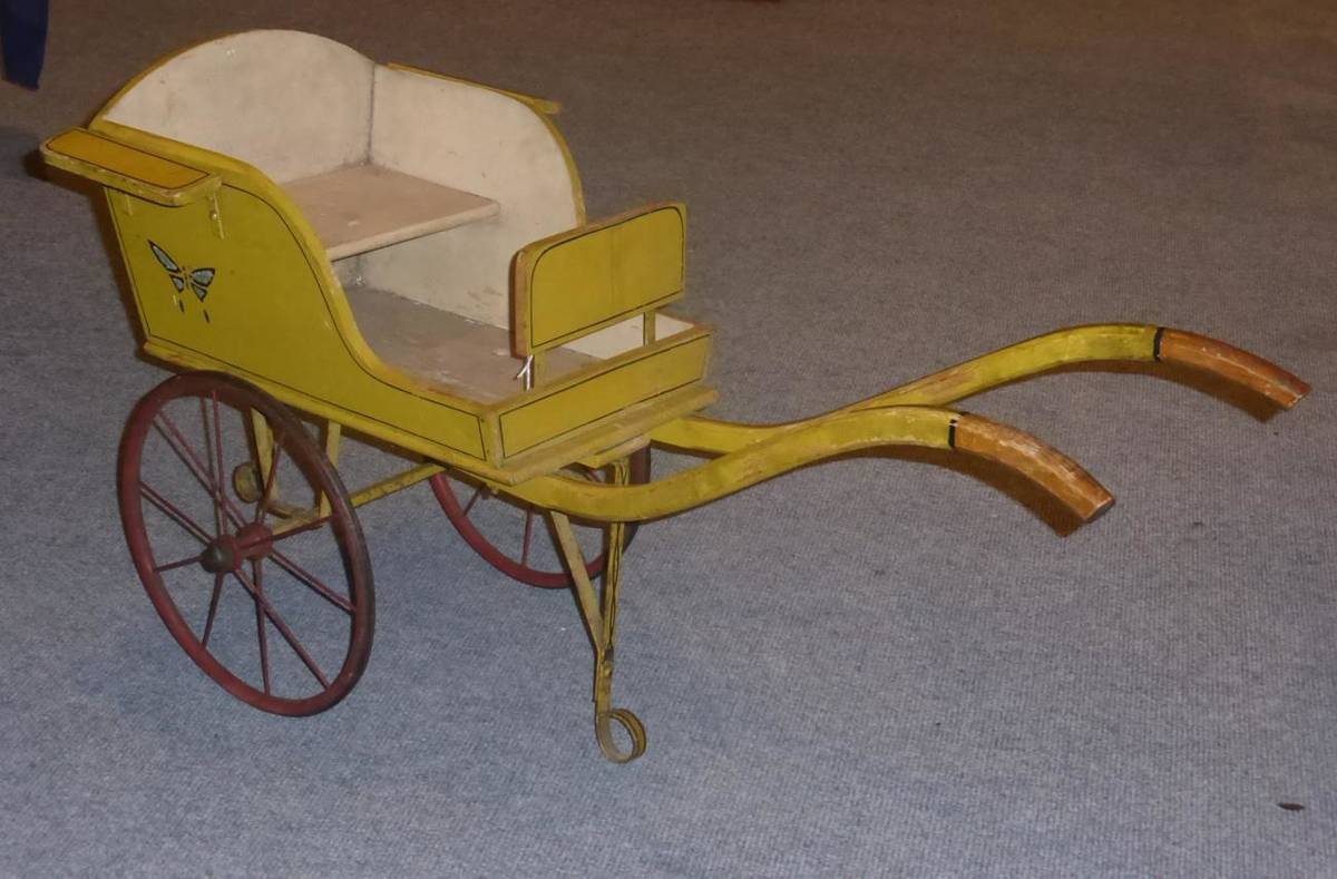 Lot 319 - A yellow painted pine child's cart, 100cm wide, bears plaque to underside 'Lord Roberts Workshop'