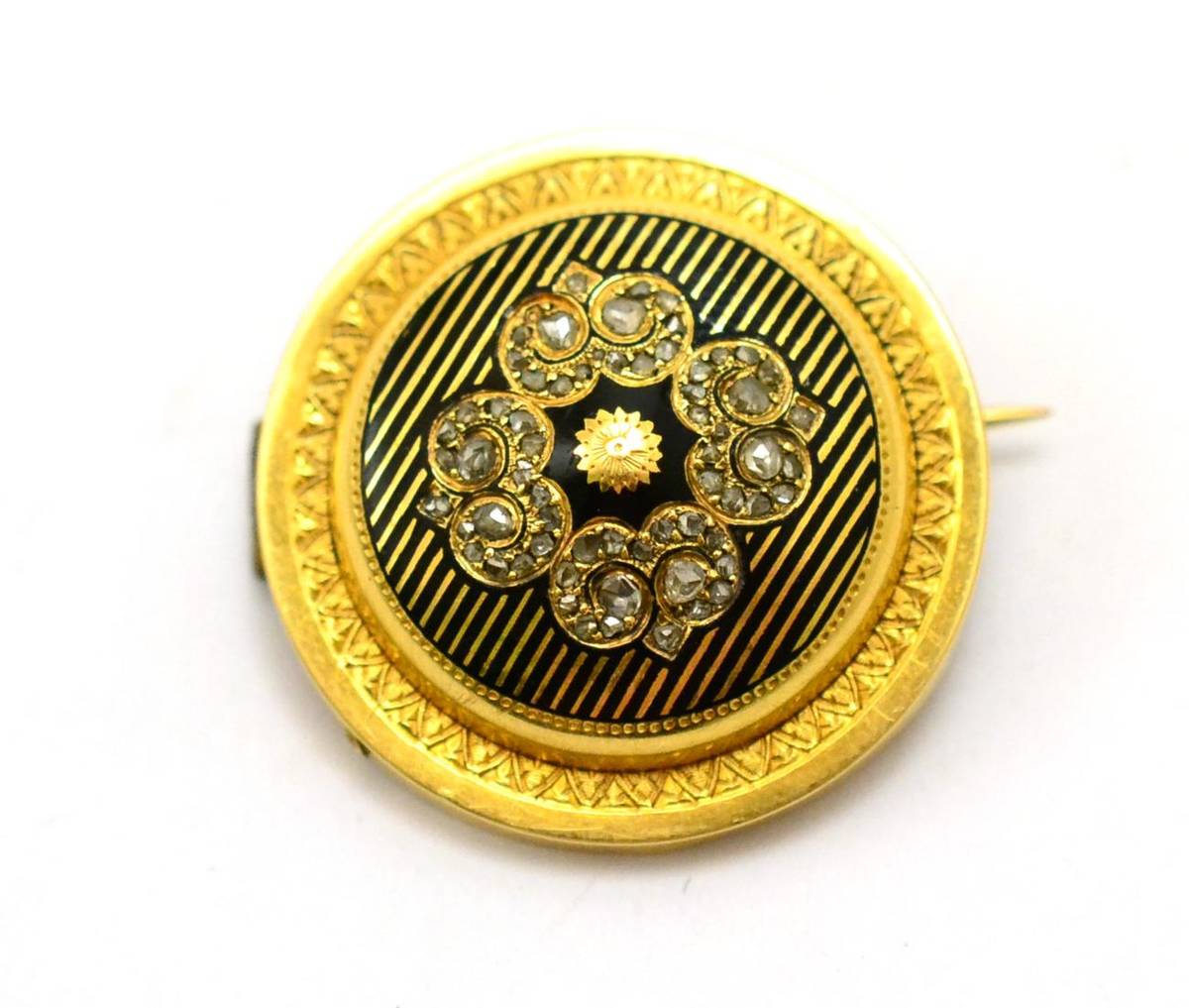 Lot 347 - # A Victorian brooch, the circular form with rose cut diamond quatrefoil motif centrally, and black