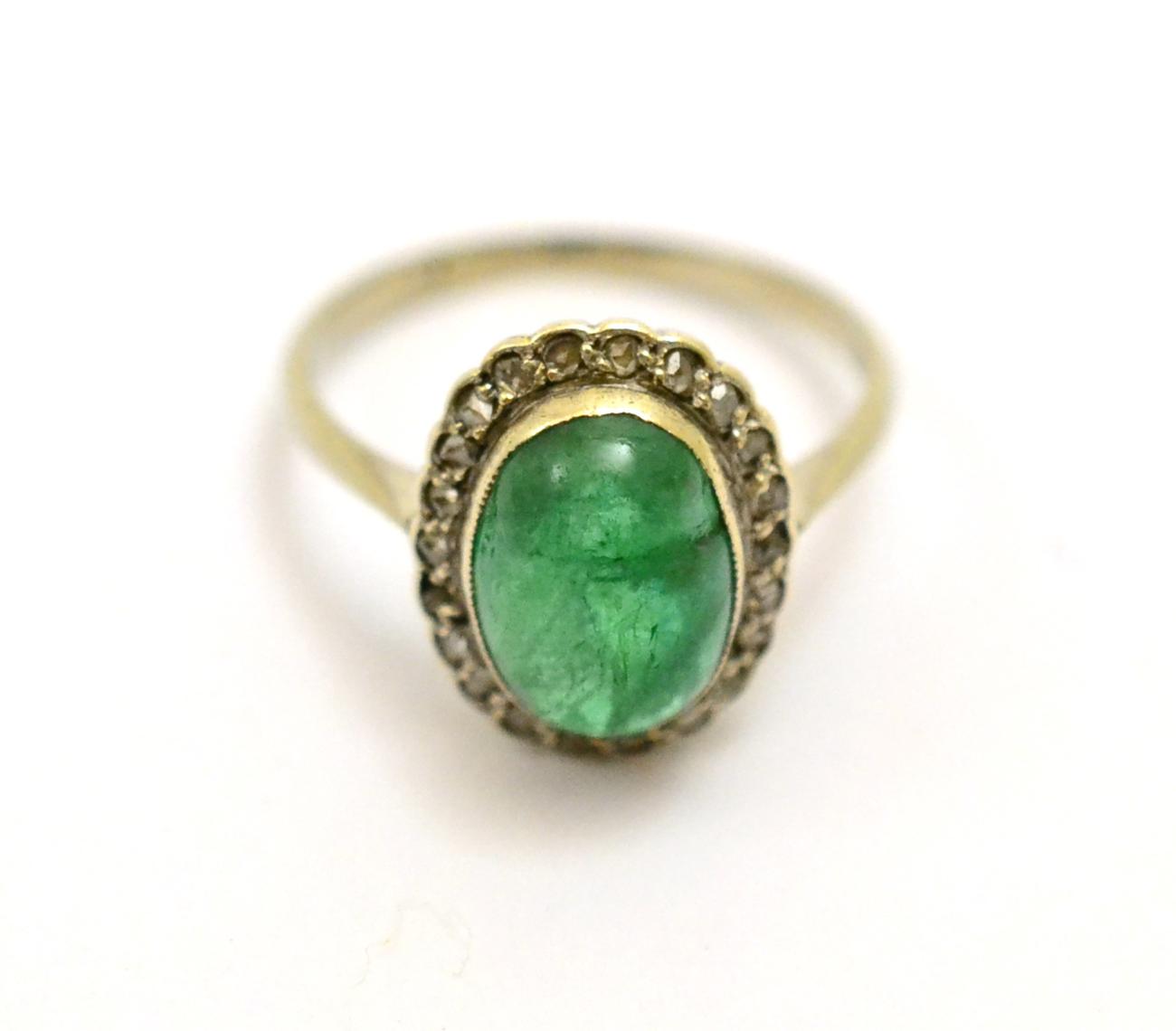 Lot 367 - # An emerald and diamond cluster ring, the oval cabochon emerald within a border of rose cut...