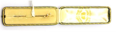 Lot 382 - An early 20th century pearl tie pin, three seed pearls on a knife edge twist bar, on a pin with...