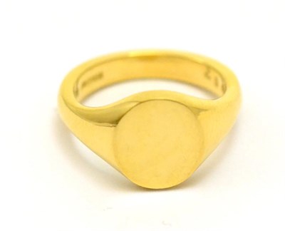 Lot 387 - An 18ct gold signet ring, the plain polished head on integral shank, finger size L1/2