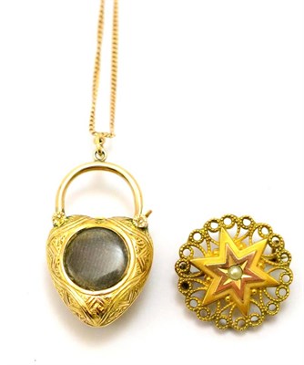 Lot 390 - A Victorian locket, inset with an oval cut garnet and three chrysoberyls, adapted as a pendant,...