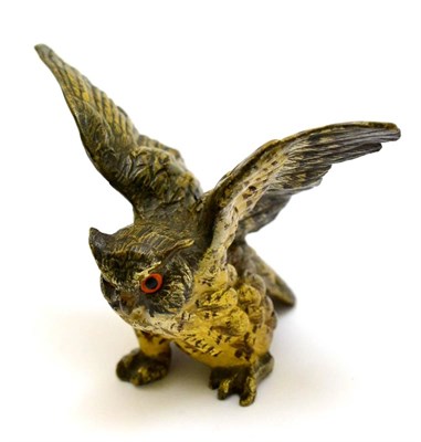 Lot 399 - A cold painted bronze figure of an owl in flight, height 8cm