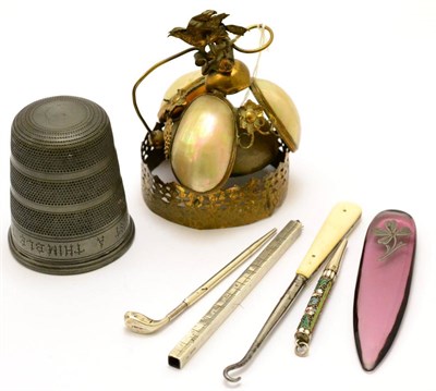 Lot 401 - A 19th century French gilt metal and mother-of-pearl counter bell, a golf club pencil, a silver...