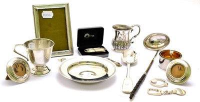 Lot 403 - A collection of silver including a silver dish, tablespoon, money clips, christening set, etc