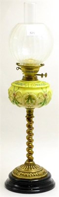 Lot 420 - Victorian brass oil lamp with spiral turned support and a yellow glass reservoir, height...