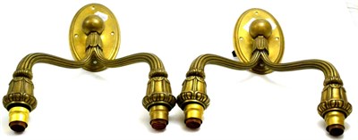 Lot 421 - A pair of Art Deco brass double wall lights/sconces, on oval backs, unmarked, 40cm
