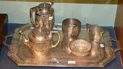 Lot 429 - A silver plated Indian style five piece tea service comprising coffee pot, teapot, sugar bowl, milk