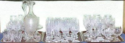 Lot 441 - Three trays of crystal drinking glasses and an engraved claret jug with two matching glasses