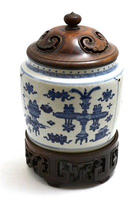 Lot 451 - A 19th century Chinese blue and white bowl, the body with four drilled holes, raised on a...