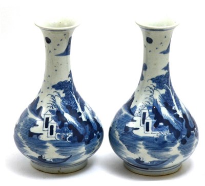 Lot 467 - A pair of Chinese porcelain bottle vases, painted in underglaze blue with mirror images of...