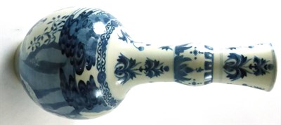 Lot 472 - A Chinese porcelain bottle vase, Kangxi reign mark but probably 19th century, with garlic neck,...