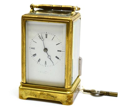 Lot 495 - A brass striking carriage clock, circa 1890, carrying handle, enamel dial with Roman numerals, twin