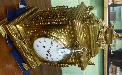 Lot 536 - A gilt metal striking mantel clock, circa 1890, the elaborate case with swag and scroll decoration