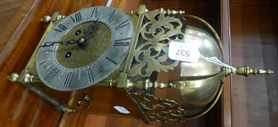 Lot 537 - A striking lantern type mantel clock, early 20th century, four posted case with side doors,...
