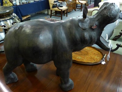 Lot 538 - A leather hippo footstool, height 61cm