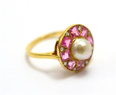 Lot 544 - # An early 20th century cluster ring, with a central pearl to a border of step cut pink stones...