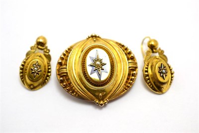 Lot 554 - # A Victorian brooch and earring suite with blue enamel star detail and seed pearls inset,...