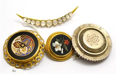 Lot 557 - # Four brooches, including; a white metal circular brooch engraved centrally with oak leaves...