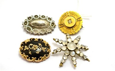 Lot 560 - # Four brooches, including; a Victorian brooch with an old cut diamond centrally, with locket back