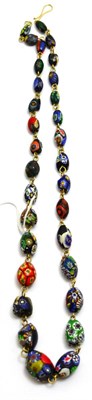 Lot 573 - A millefiori necklace, of mixed shape beads, length 70cm