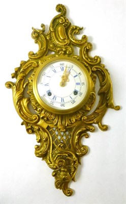 Lot 588 - A French Louis XV style gilt metal cartel clock with circular dial and Roman numerals