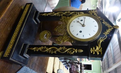 Lot 602 - A black slate and ormolu mounted striking portico mantel clock, circa 1800, the architectural...