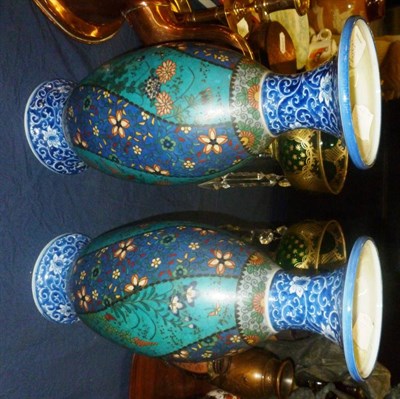 Lot 607 - A pair of Japanese cloisonne enamel on porcelain polychrome decorated vases, height 31cm