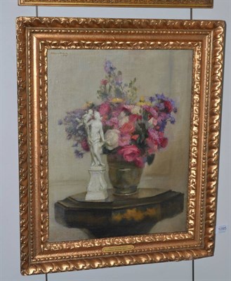 Lot 1095 - H. Harris Brown (Mid 20th century) Still life of assorted flowers with a figurine, signed and dated