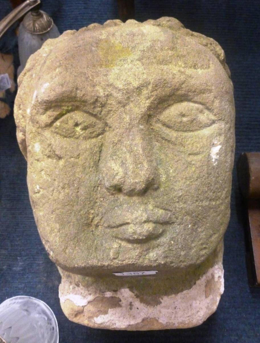 Lot 1357 - A carved Medieval style stone head, probably 19th century, 33cm high