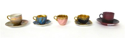 Lot 3 - * A Royal Doulton named castle decorated cabinet cup and saucer; a similar flambe cup and...