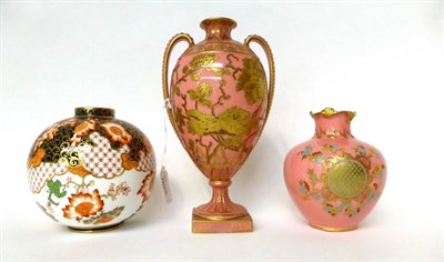 Lot 24 - * A Royal Crown Derby pink ground urn shaped vase with gilt decoration, 24cm high; a similar...