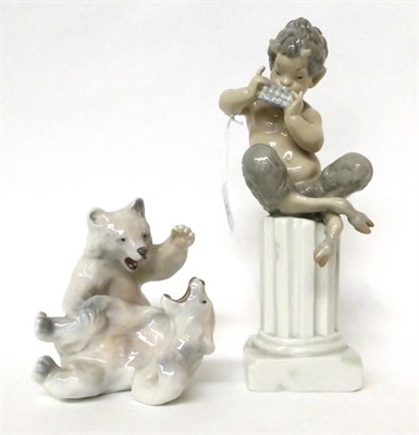 Lot 29 - * A Lladro figure of Pan sitting on a column, 28cm; and a Royal Copenhagen group of two bears, 14cm