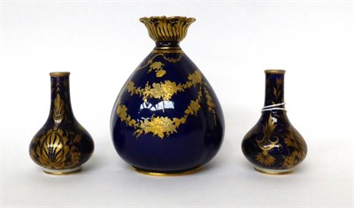 Lot 30 - * A pair of early 19th century Derby porcelain blue ground bottle vases with gilt decoration,...