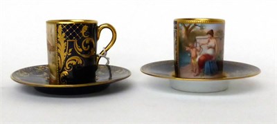 Lot 45 - * A Vienna style porcelain blue ground cabinet cup and saucer painted with classical figures; and a