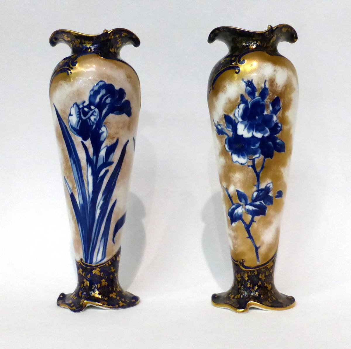 Lot 71 - * A matched pair of Doulton Burslem Flow Blue slender baluster vases, 28cm