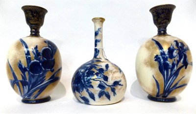 Lot 78 - * A Doulton Burslem Flow Blue bottle vase, 21cm; and a pair of ovoid vases, 23cm (3)