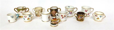 Lot 81 - * Two Royal Crown Derby miniature mugs, 4cm high; a Royal Worcester miniature mug painted with...