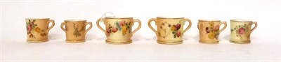 Lot 82 - * Two Royal Worcester blush ivory miniature loving cups, 4cm; two similar miniature tygs,...