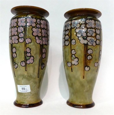 Lot 89 - * A pair of Royal Doulton Stoneware vases decorated with flowers, 27cm