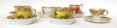 Lot 102 - * A pair of Paris yellow ground coffee cans and saucers with monochrome landscapes; a Derby...