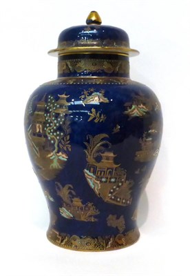 Lot 122 - * A Carltonware powder blue ground baluster jar and cover with chinoiserie decoration, 33cm high