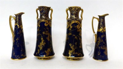 Lot 139 - * A pair of Royal Doulton blue ground twin-handled vases with gilt foliate decoration, 17.5cm;...