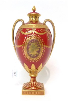 Lot 145 - * A Royal Crown Derby twin-handled classical urn shaped vase and cover, gilt with medallions...