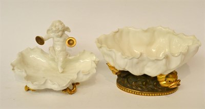 Lot 154 - * A Moore Brothers shell dish, surmounted by a cherub raised on gilt feet, 17cm diameter; and a...