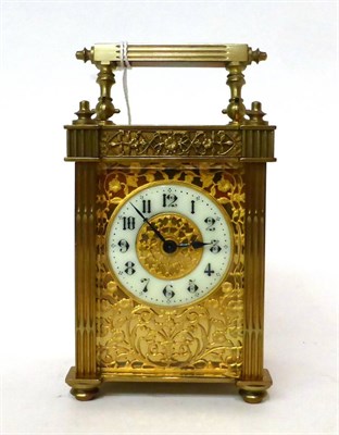 Lot 170 - * A brass carriage timepiece, circa 1900, carrying handle, glazed pierced side panels, enamel...